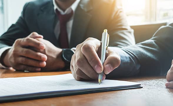 businessmen-sign-deal-agreement-news